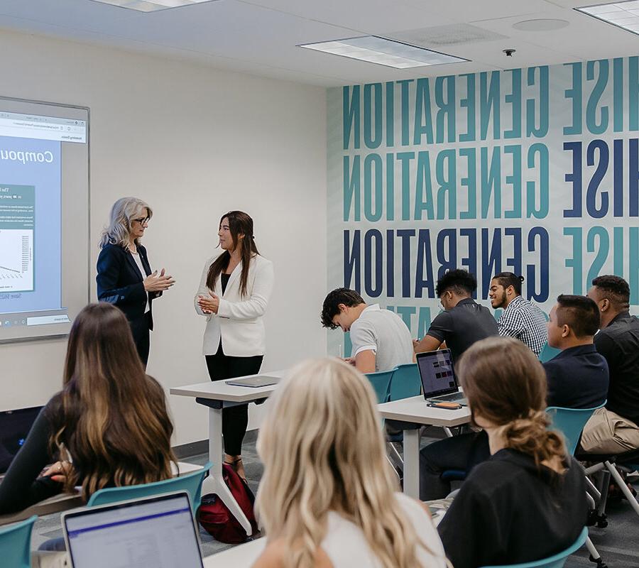 students participating in a classroom lecture with a power point presentation